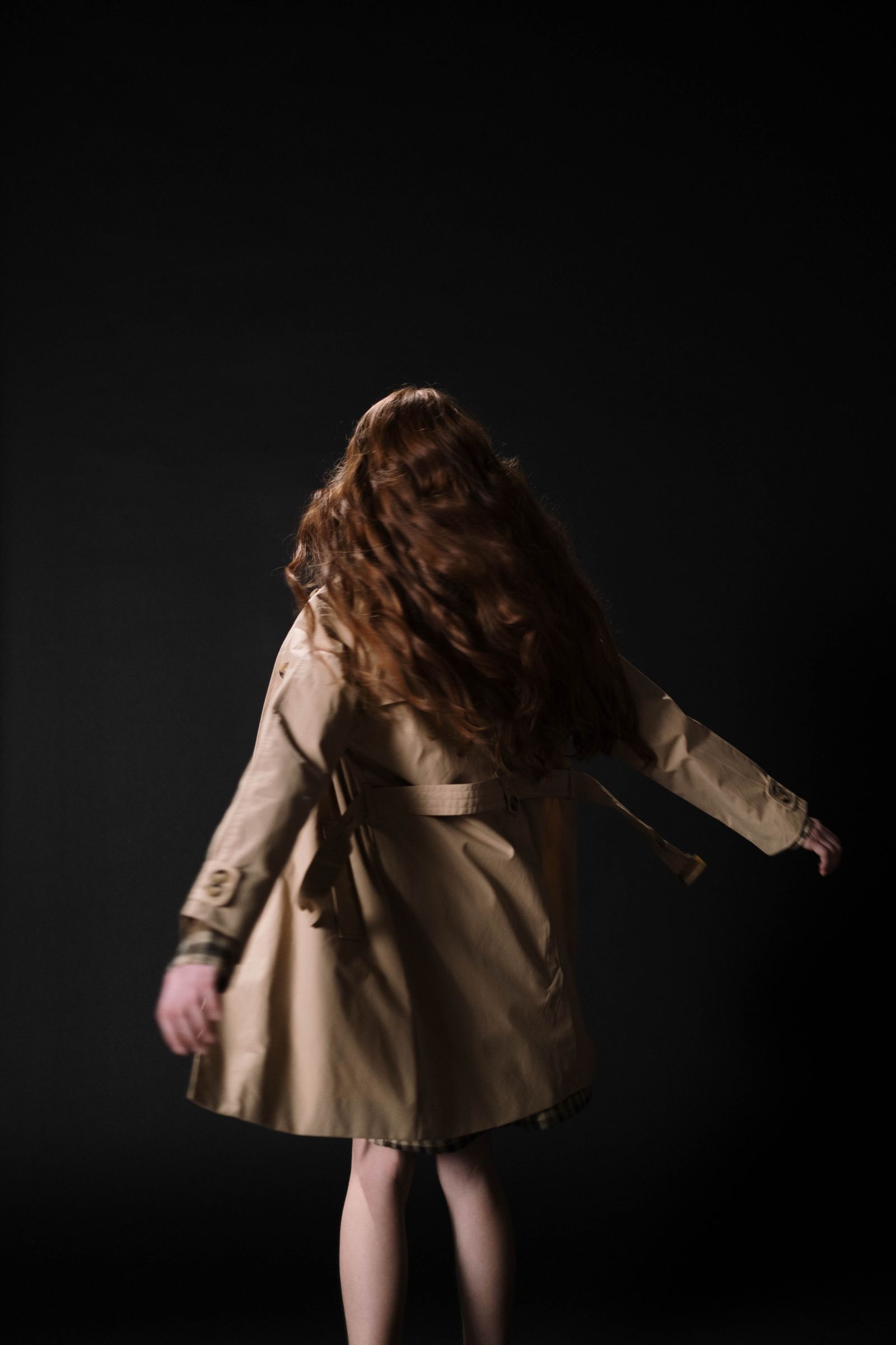 Model wearing a beige coat from the 2MH collection